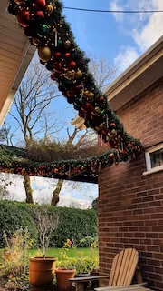 This external be-icicled garland with its abundant rich reds, soft golds and forest greens was a suspended, and very happy surprise for our client’s lovely wife. 