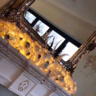 Garlands are not just for Christmas! This special Tearoom Garland, adorned with Swarovski crystal sparkling teacups, is a glamorous photographic backdrop for visiting VIP celebrants.