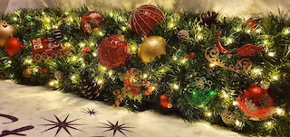 This Childhood Revisited garland in the wonderfully traditional red, gold and green was commissioned by new grandparents for their holiday lodge. What a fantastic and exciting view for any aged child!